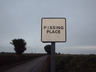 pissing place sign